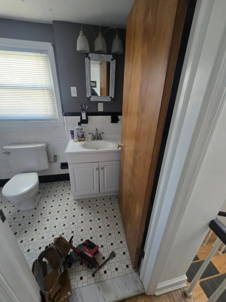 Bristol CT bathroom before remodeling, with contractor tools staged for demolition