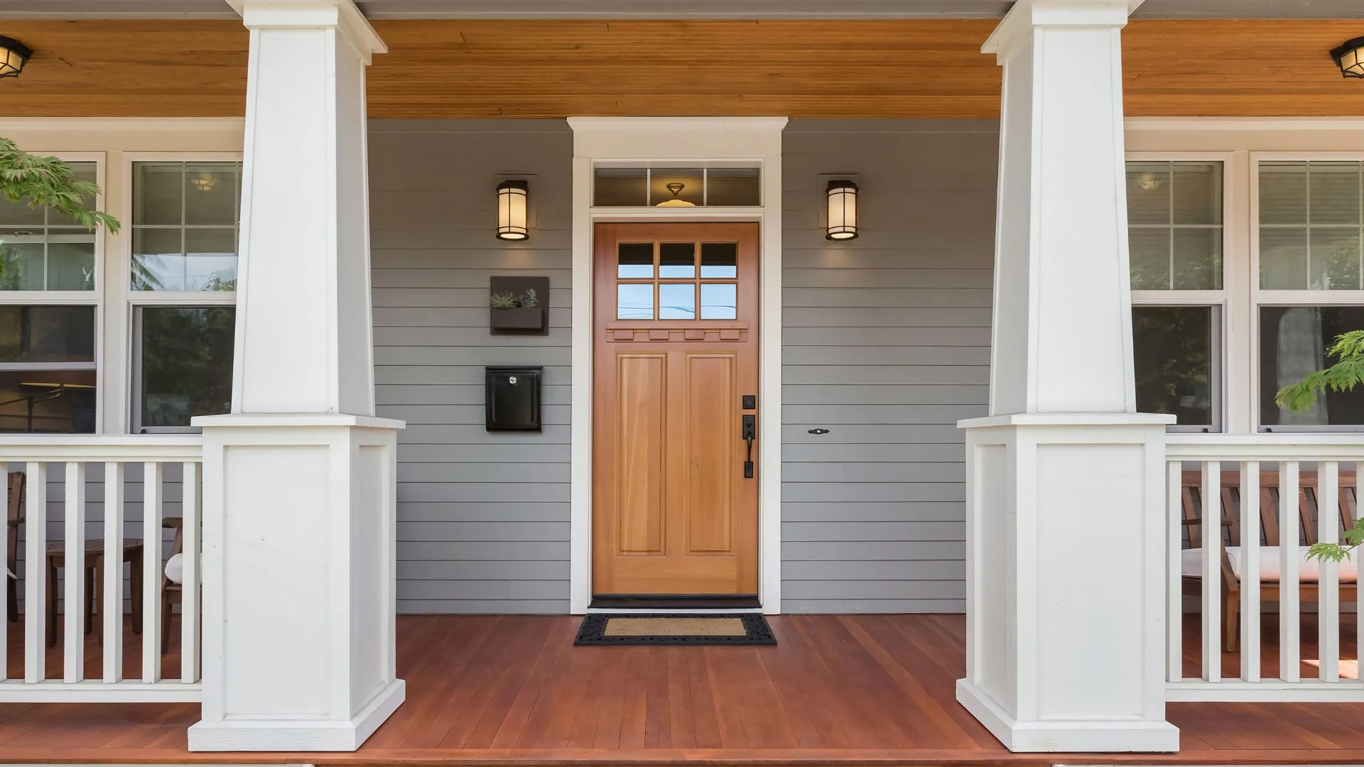 Newly installed craftsman-style front entry door on a covered porch