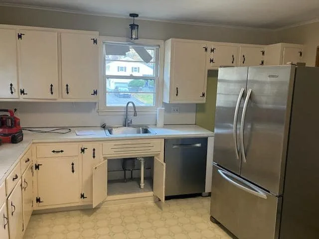 West Hartford CT kitchen before remodeling with white cabinets and open sink plumbing