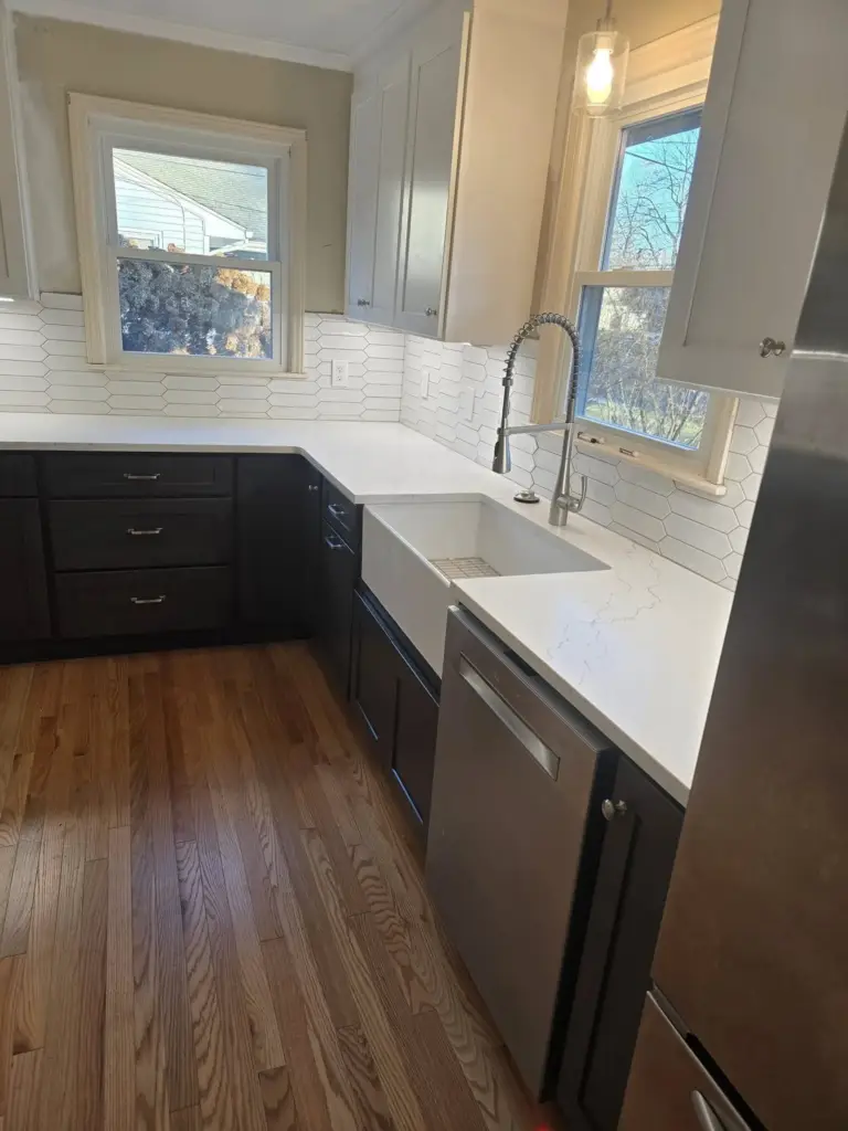 Remodeled West Hartford CT kitchen with farmhouse sink and quartz countertops