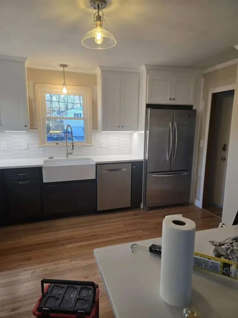 Two-tone West Hartford CT kitchen remodel with farmhouse sink and stainless appliances