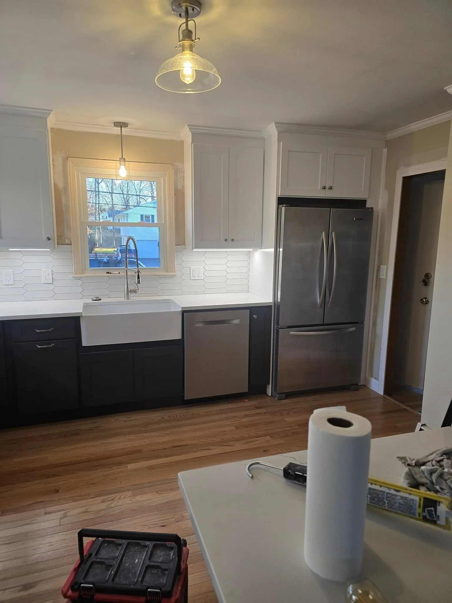 Two-tone West Hartford CT kitchen remodel with farmhouse sink and stainless appliances