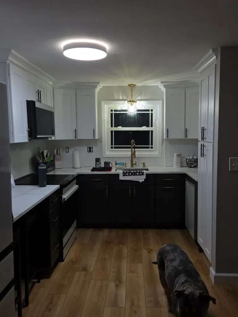 Bristol CT kitchen remodel with pendant light over the sink window and two-tone shaker cabinets