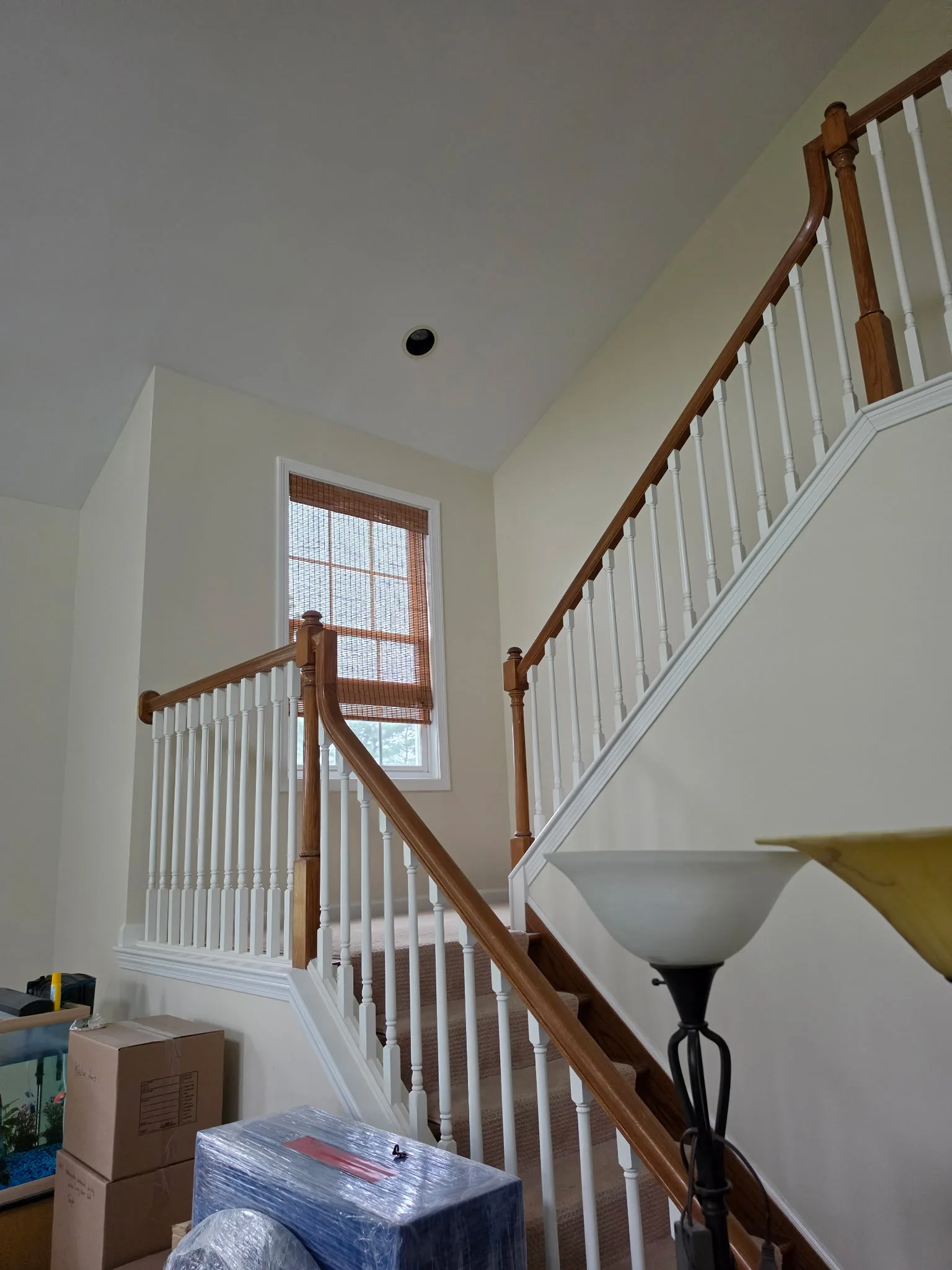 Rebuilt stairway wall with fresh drywall and paint in a Cromwell CT condo