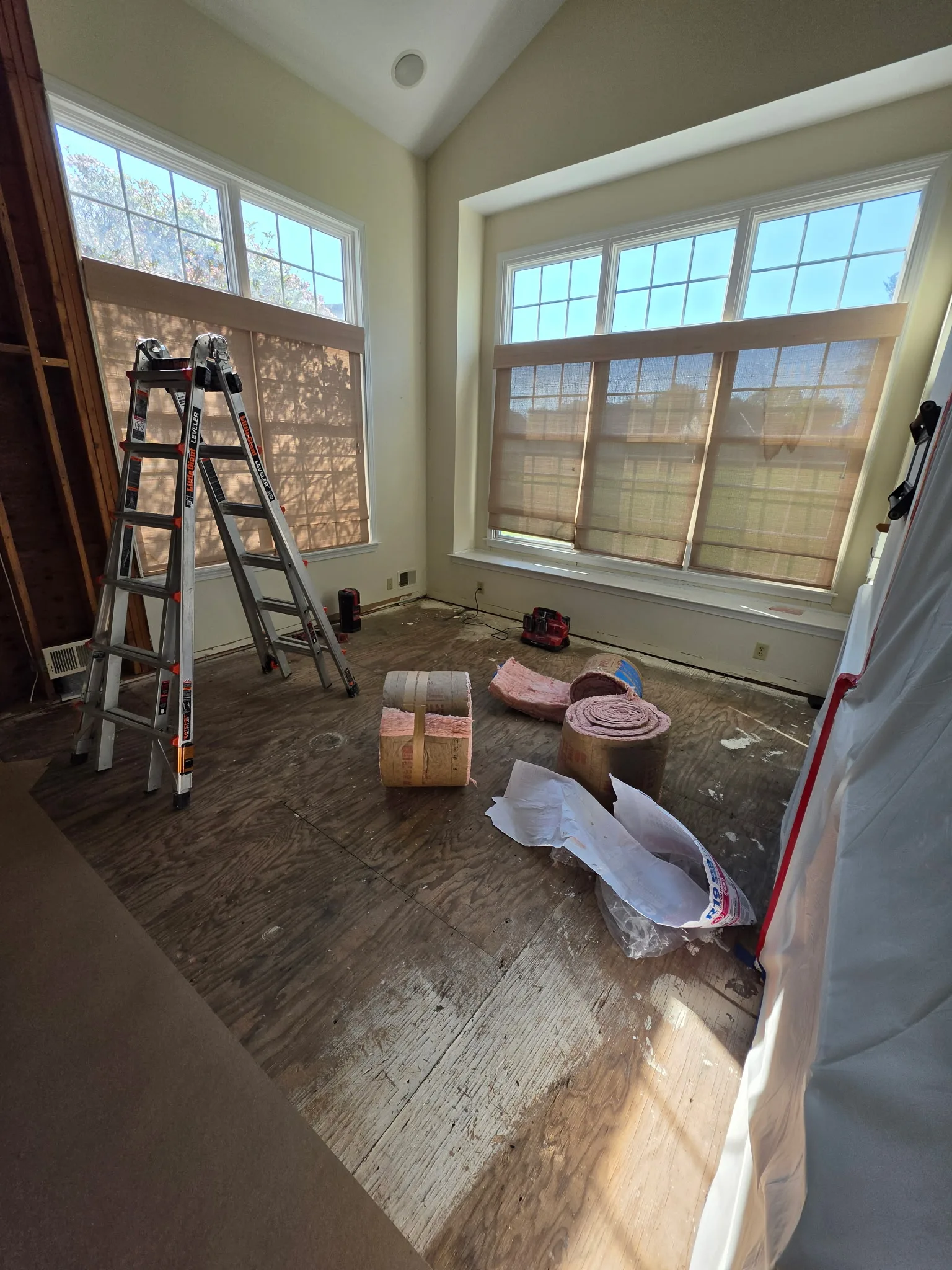 Exposed subfloor and opened wall during the water damage rebuild in a Cromwell CT condo